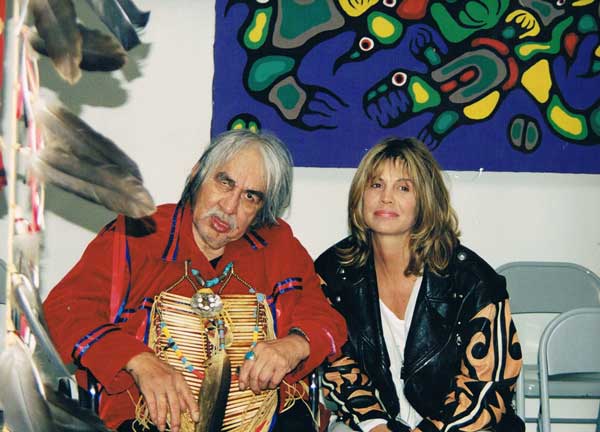 Norval Morrisseau and Josie Sschwiola who bought the painting behind them.